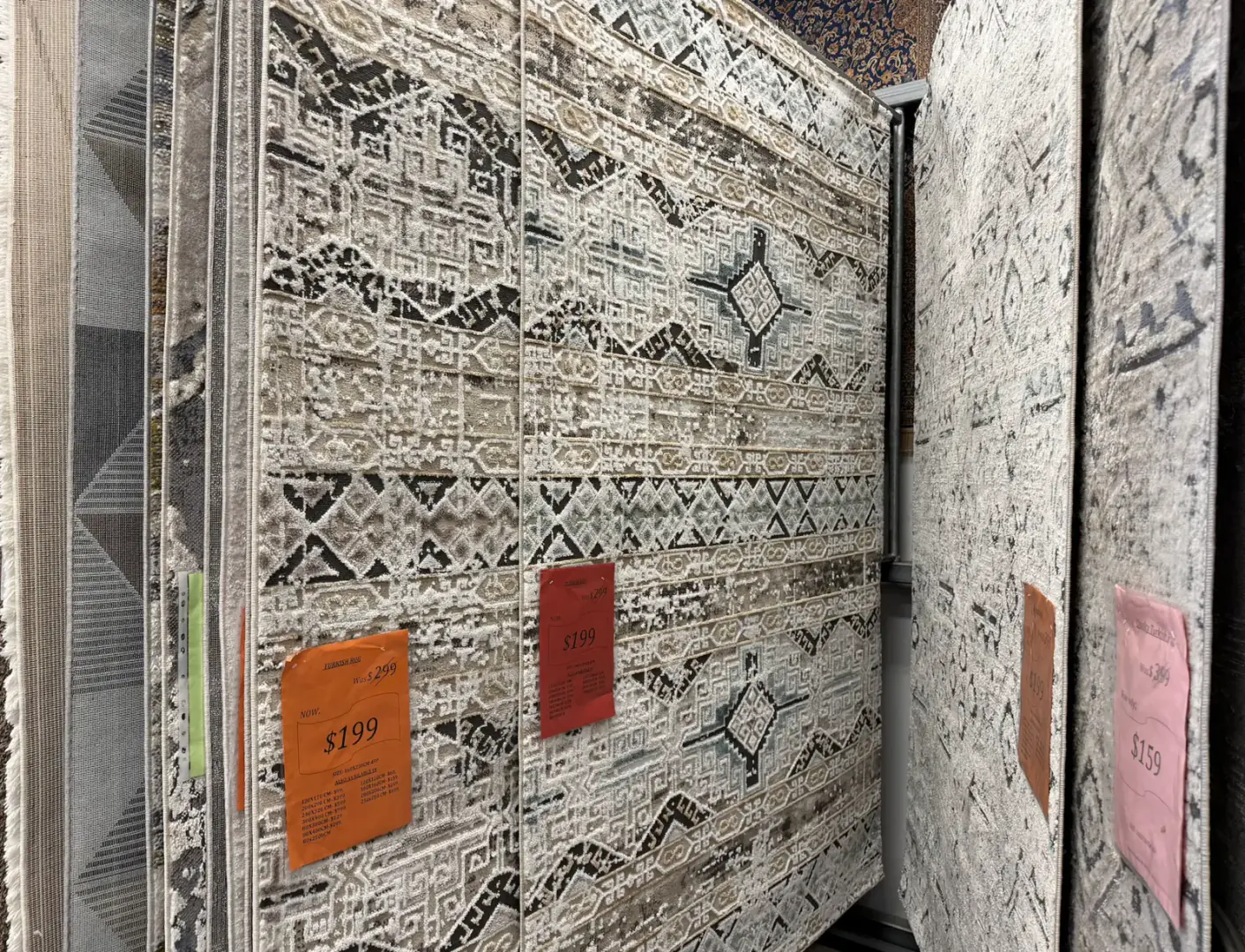 Budget friendly patterned rugs displayed in the Royal Persian Carpets showroom